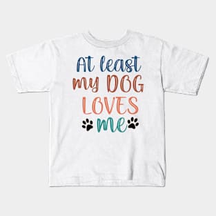 At least my dog loves me Kids T-Shirt